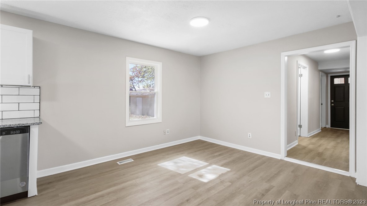 6114 Sandy Creek Road Stedman, NC 28391 - Photo 7 of 34 a view of livingroom with hardwood floor and hallway