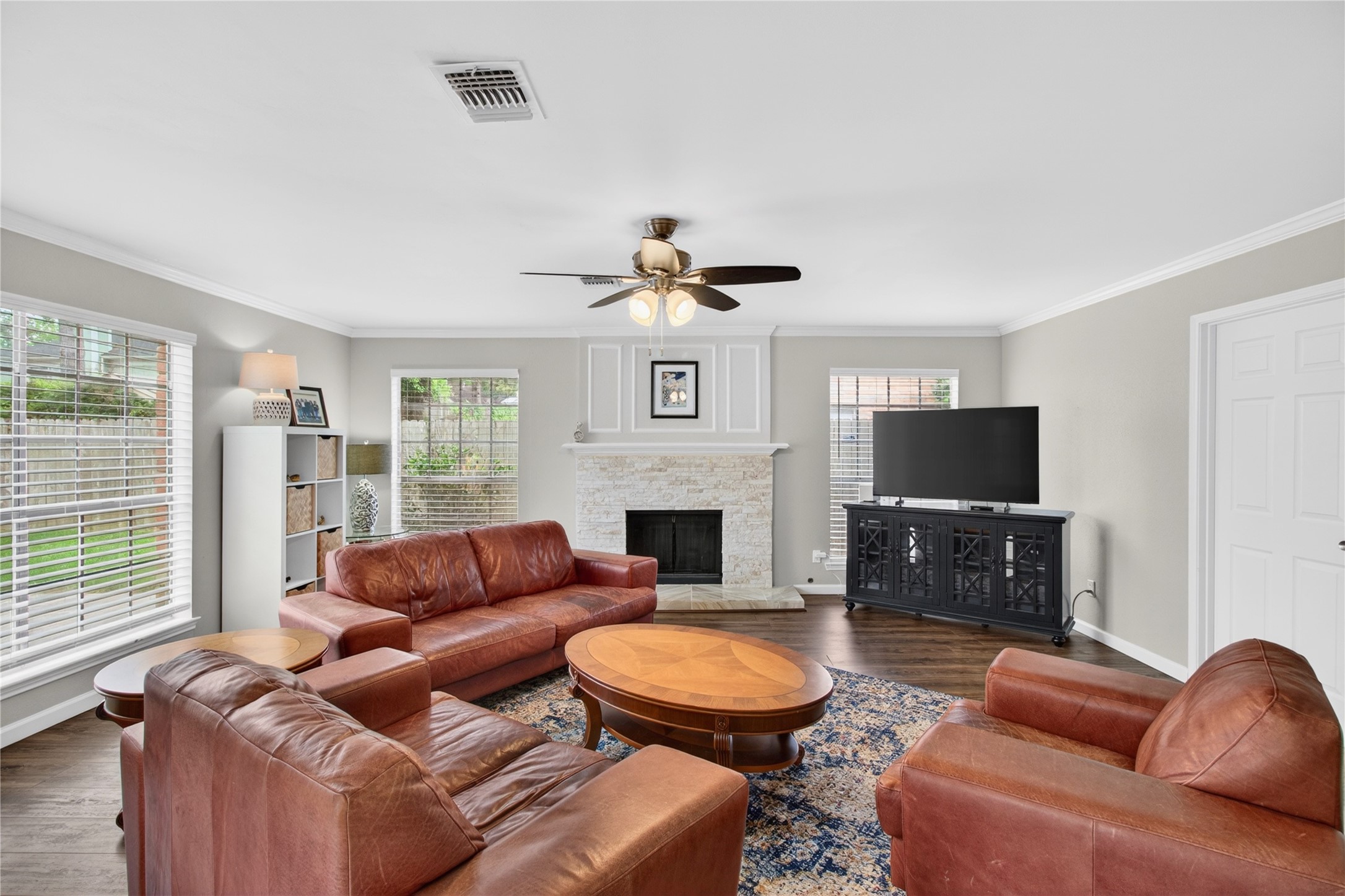 20214 Woodsboro Court Spring, TX 77388 - Photo 20 of 50 Family Room w/Recently Updated Wood-burning Fireplace w/gas connection! Doorway to Laundry Rm & Extra Rm connecting to Garage! Recently Painted Interior! Luxury Vinyl Plank throughout 1st Floor!