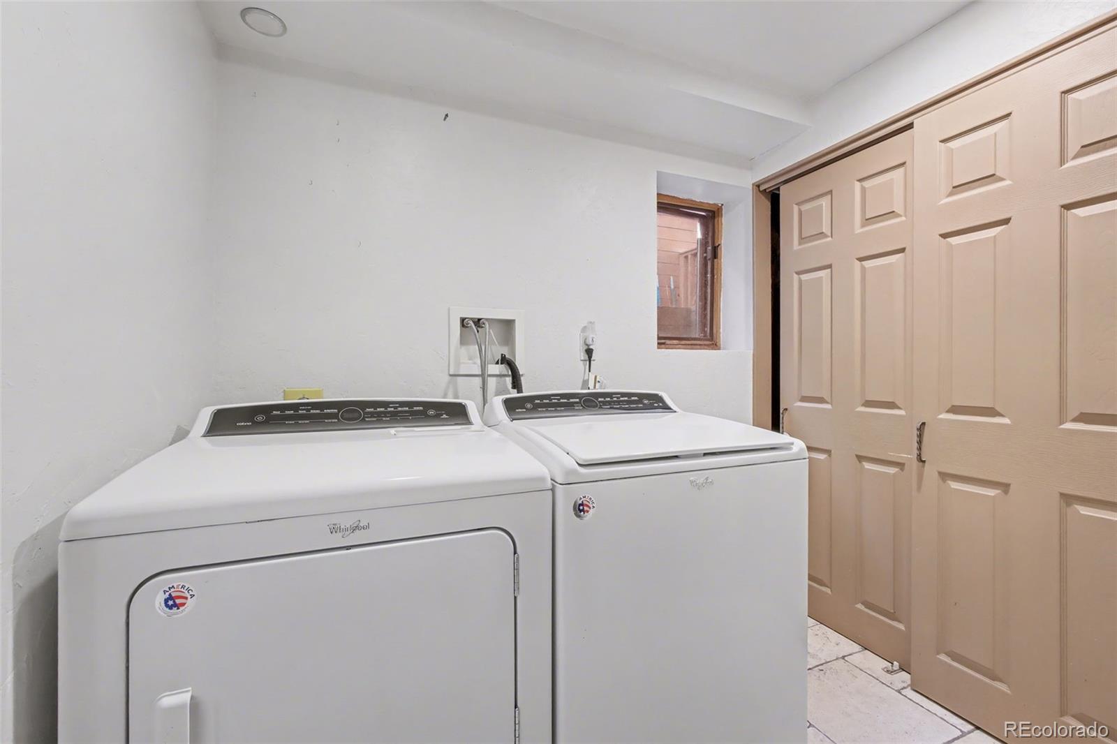 23666 Genesee Village Road Golden, CO 80401 - Photo 30 of 49 a utility room with dryer and washer