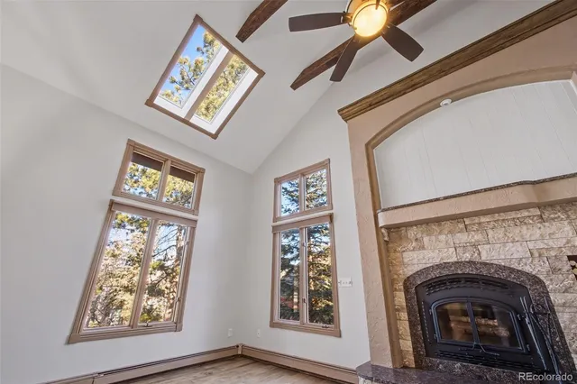 a view of that has a fireplace and a window