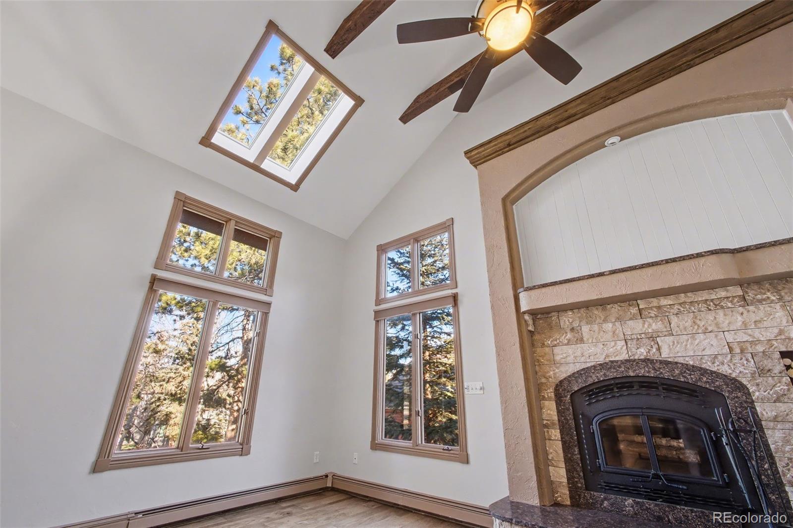 23666 Genesee Village Road Golden, CO 80401 - Photo 5 of 49 a view of that has a fireplace and a window
