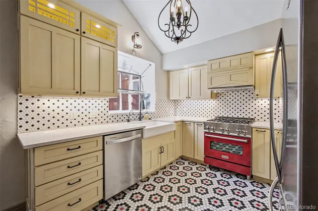 a kitchen with stainless steel appliances a stove and a refrigerator