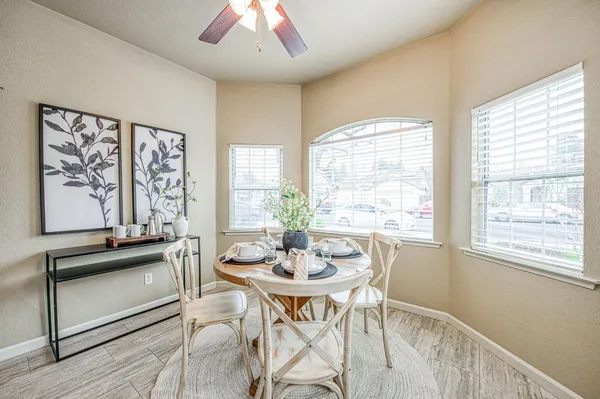 a view of a dining room with furniture window and outside view