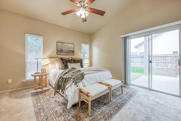 a bed room with a bed and a chandelier