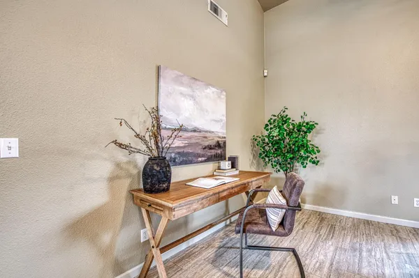 a table and a vase sitting on a table