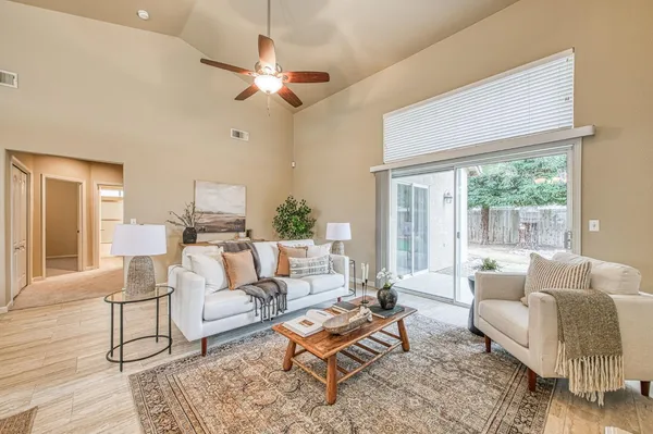 a living room with furniture and a large window