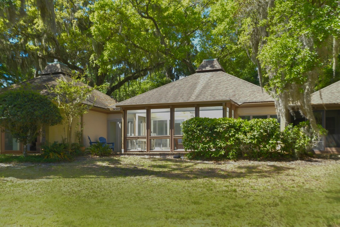 3314 Sea Marsh Road Fernandina Beach, FL 32034 - Photo 1 of 32 a front view of a house with a garden