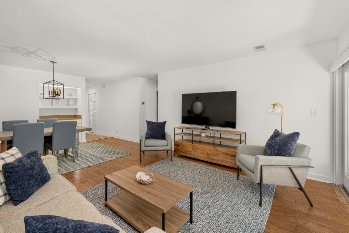 3314 Sea Marsh Road Fernandina Beach, FL 32034 - Photo 11 of 32 a living room with furniture and a flat screen tv