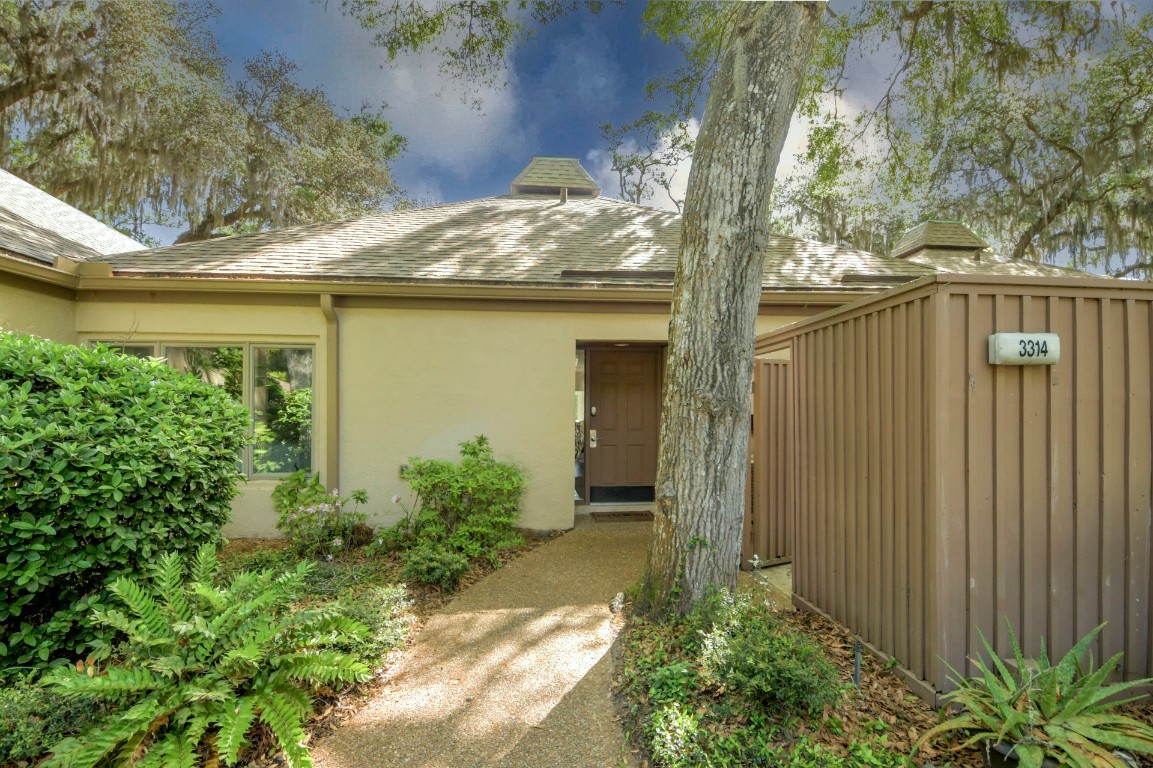 3314 Sea Marsh Road Fernandina Beach, FL 32034 - Photo 2 of 32 a yellow house with outdoor space