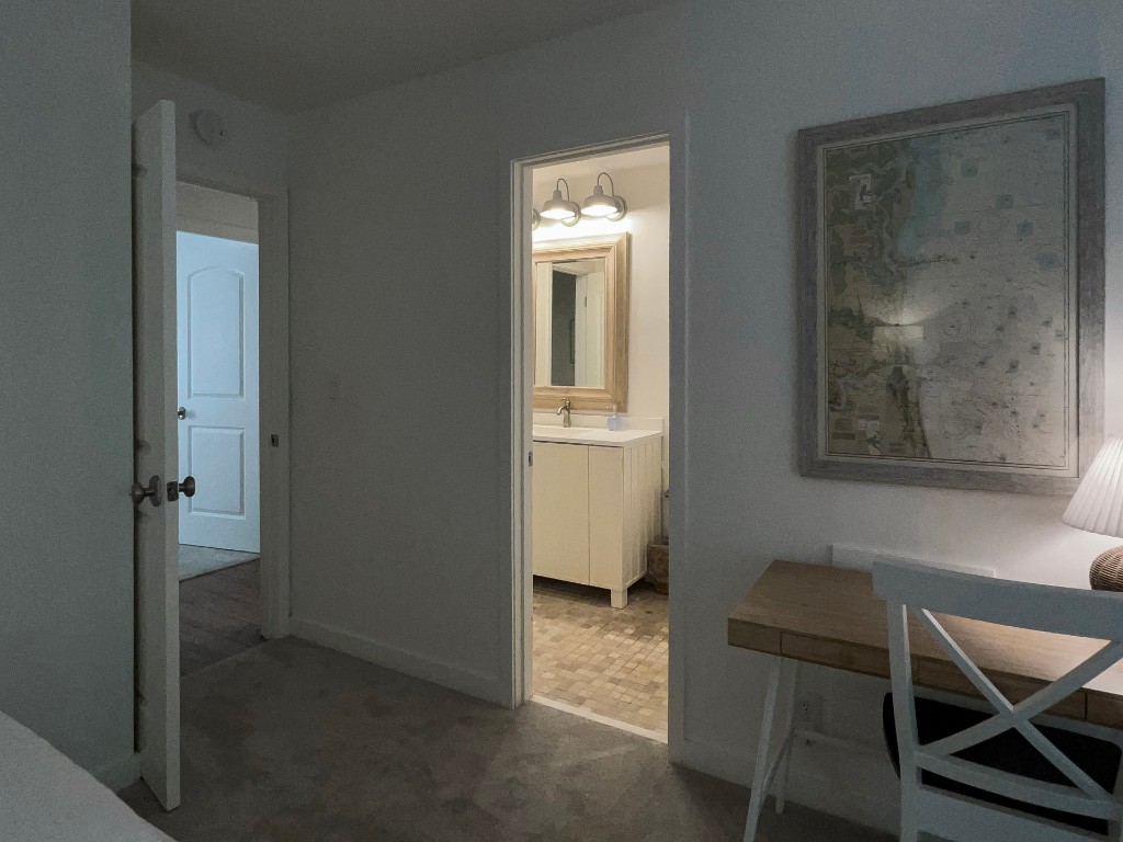 3314 Sea Marsh Road Fernandina Beach, FL 32034 - Photo 22 of 32 a view of a room that has a bed and a chair in it