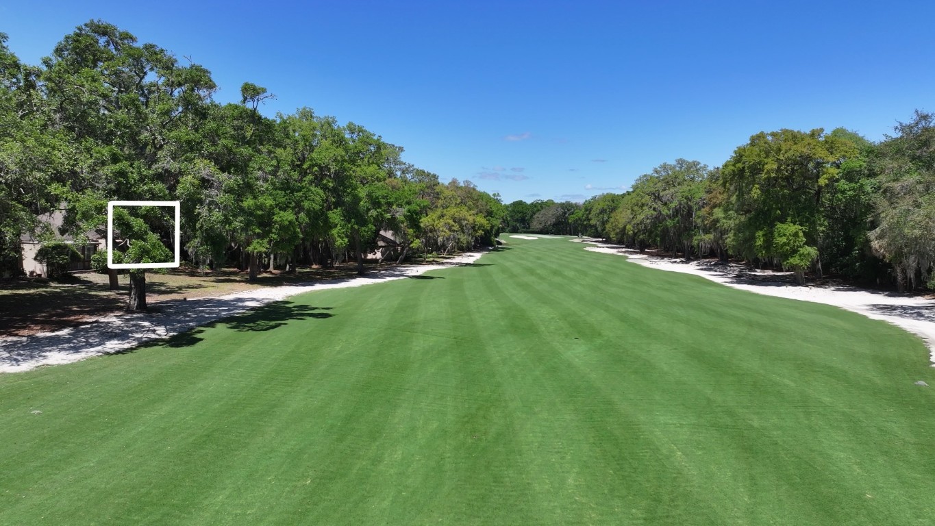 3314 Sea Marsh Road Fernandina Beach, FL 32034 - Photo 30 of 32 a backyard of a house with table and chairs