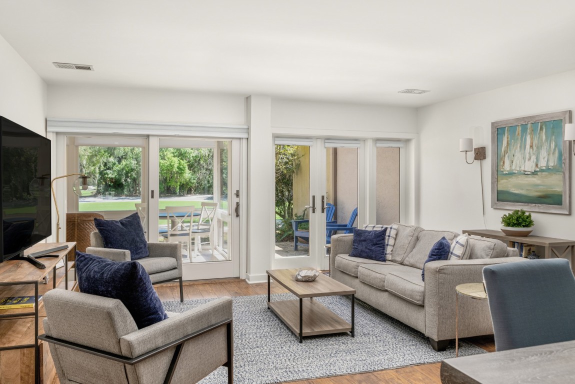 3314 Sea Marsh Road Fernandina Beach, FL 32034 - Photo 7 of 32 a living room with furniture and a flat screen tv