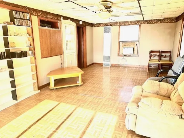 a spacious bedroom with a bed and a window