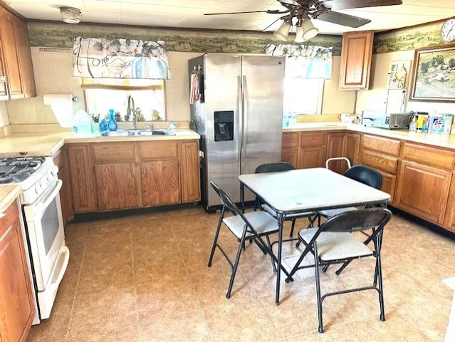 a kitchen with a table and chairs in it