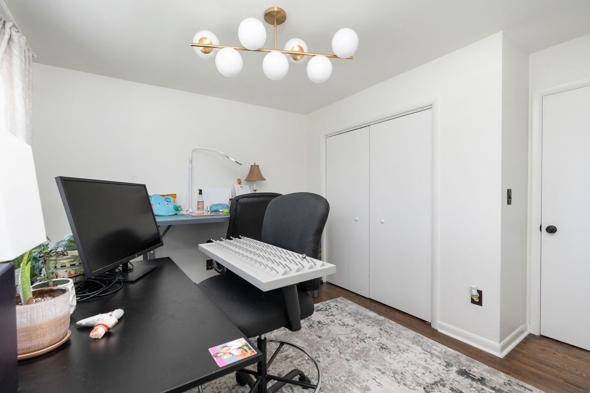 3739 Stony Point Road Charlottesville, VA 22911 - Photo 33 of 72 a view of a workspace with furniture and a chandelier