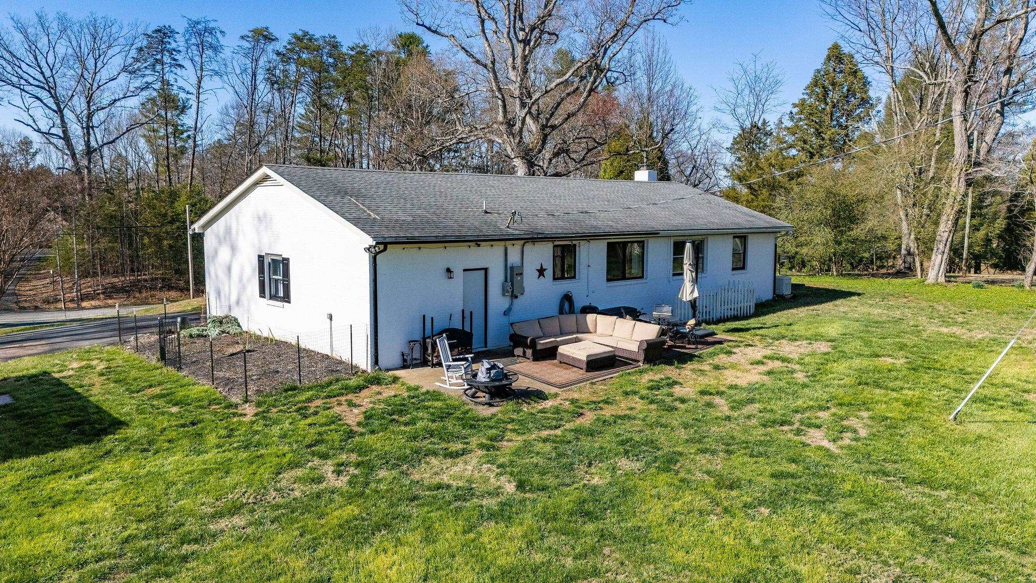 3739 Stony Point Road Charlottesville, VA 22911 - Photo 48 of 72 a front view of house with yard and trees in the background