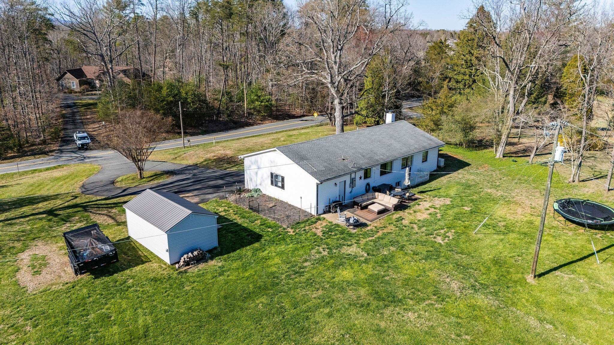 3739 Stony Point Road Charlottesville, VA 22911 - Photo 54 of 72 an aerial view of a house with swimming pool and large trees