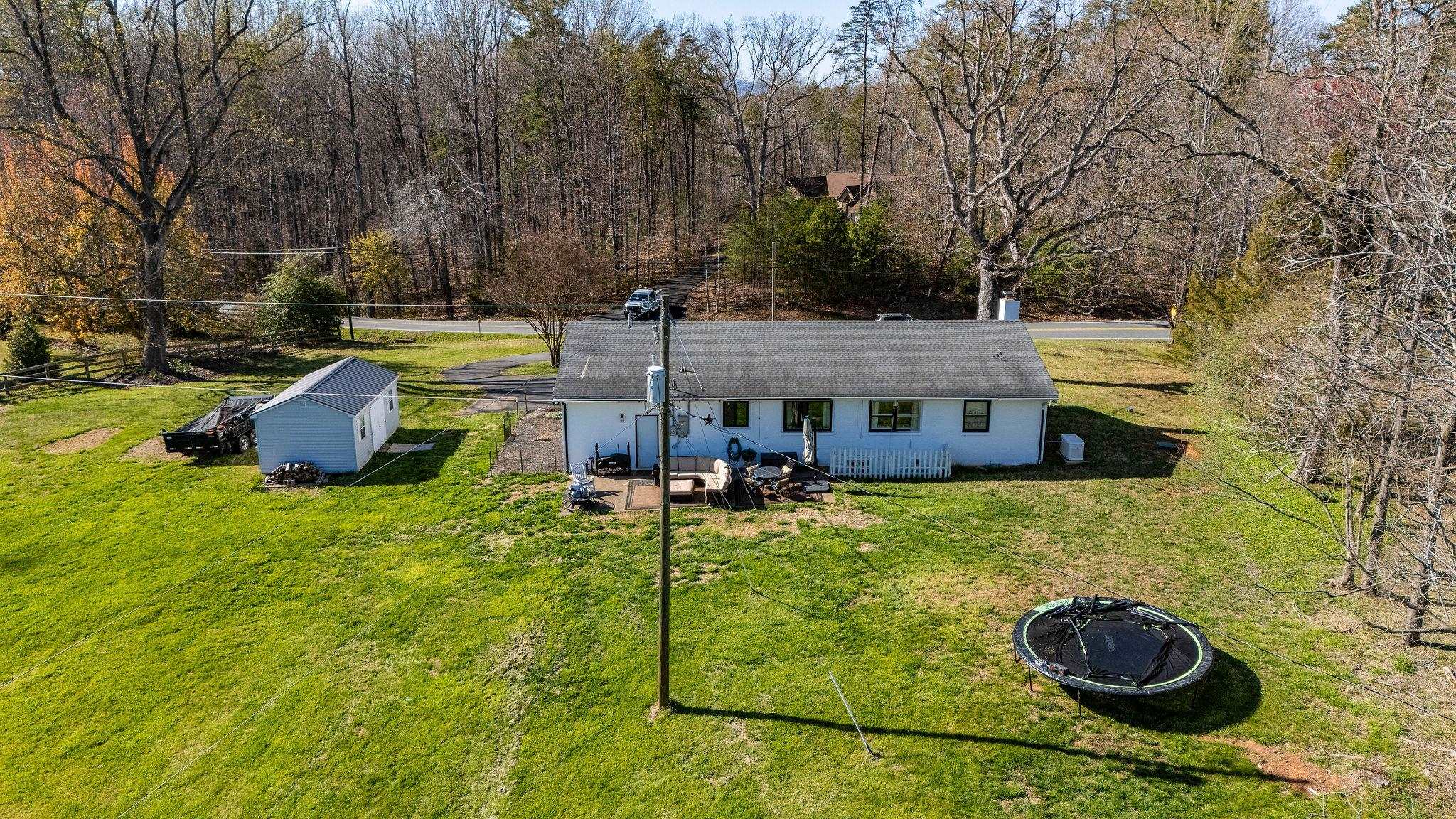 3739 Stony Point Road Charlottesville, VA 22911 - Photo 55 of 72 a backyard of a house with table and chairs