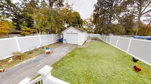 a view of a backyard with a small cabin