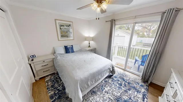 a bedroom with a bed and a mirror