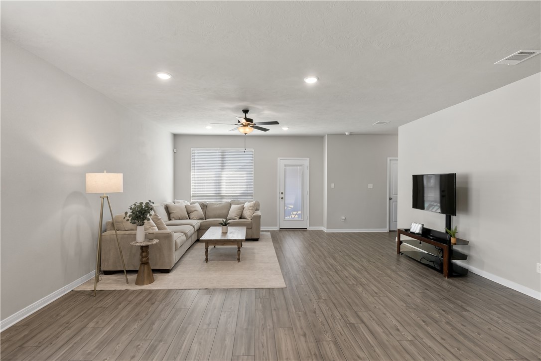 1925 Viva Road Bryan, TX 77807 - Photo 10 of 25 Living room with light wood-style floors, recessed lighting, and ceiling fan