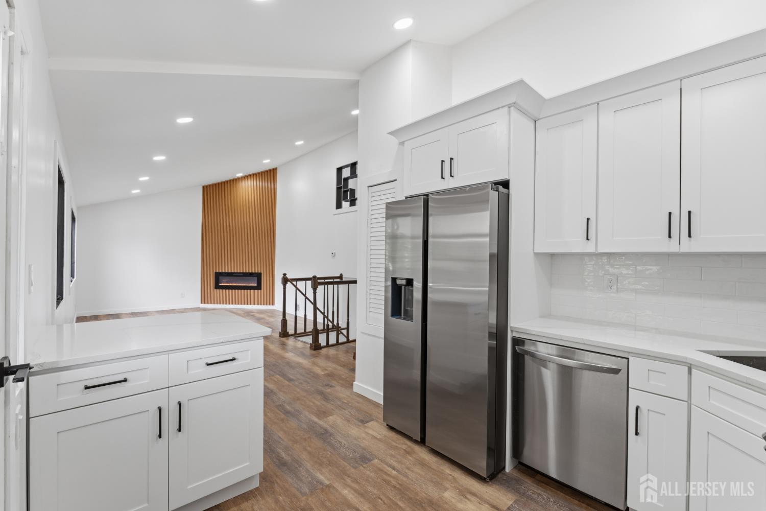 12 Daniel Road Spotswood, NJ 08884 - Photo 9 of 27 a kitchen with white cabinets and stainless steel appliances