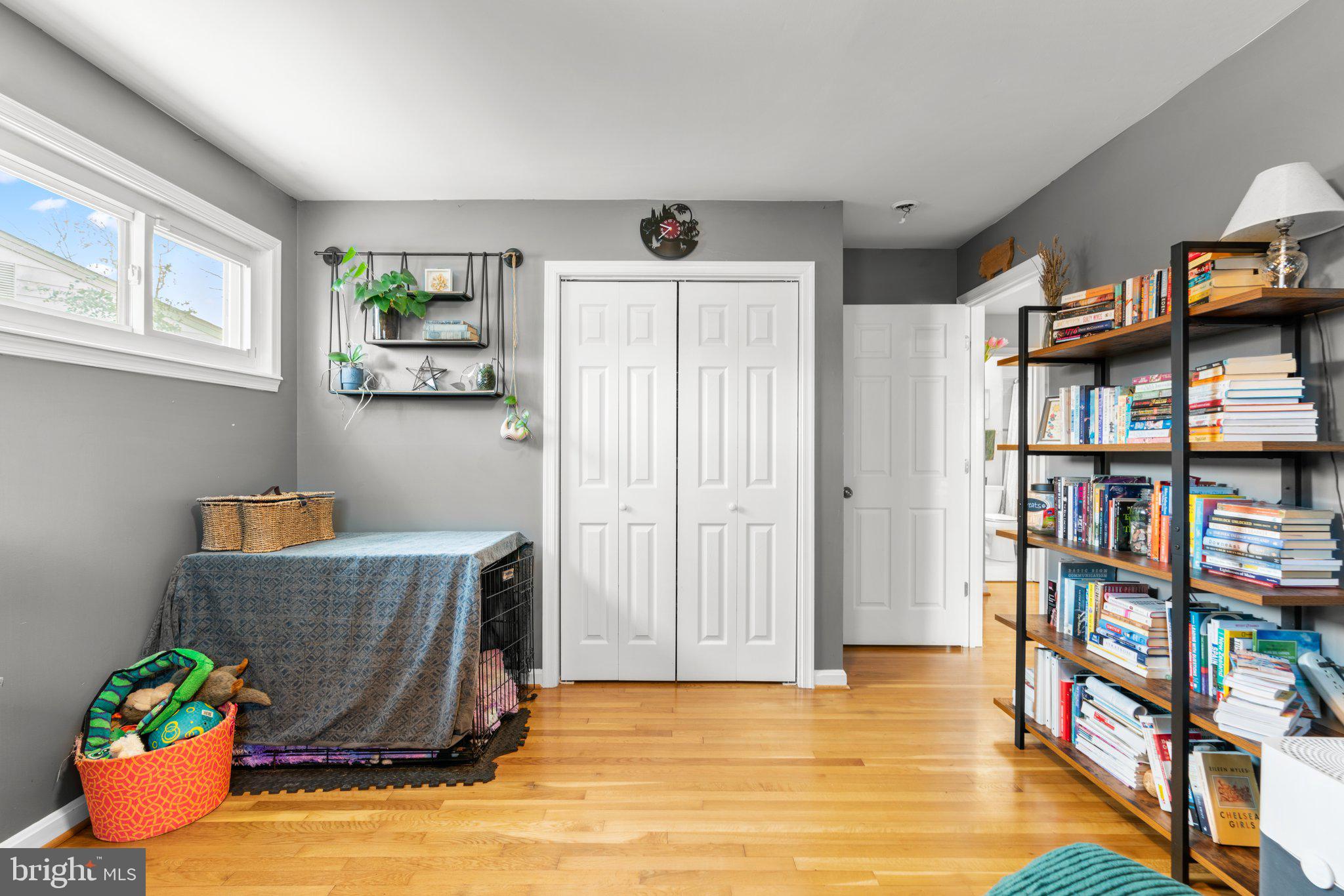 609 Perth Place Silver Spring, MD 20901 - Photo 23 of 46 a living room with bookshelf and a window