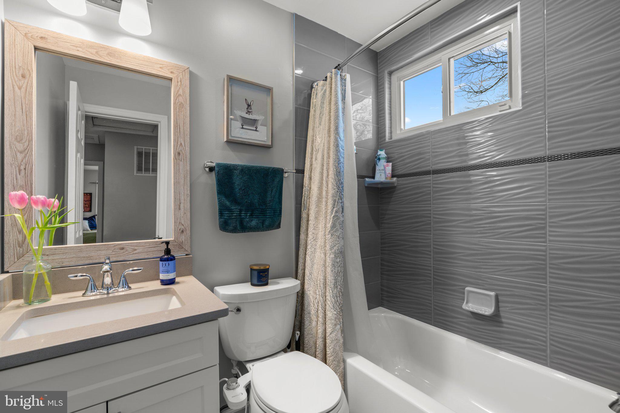 609 Perth Place Silver Spring, MD 20901 - Photo 24 of 46 a bathroom with a sink a toilet and shower