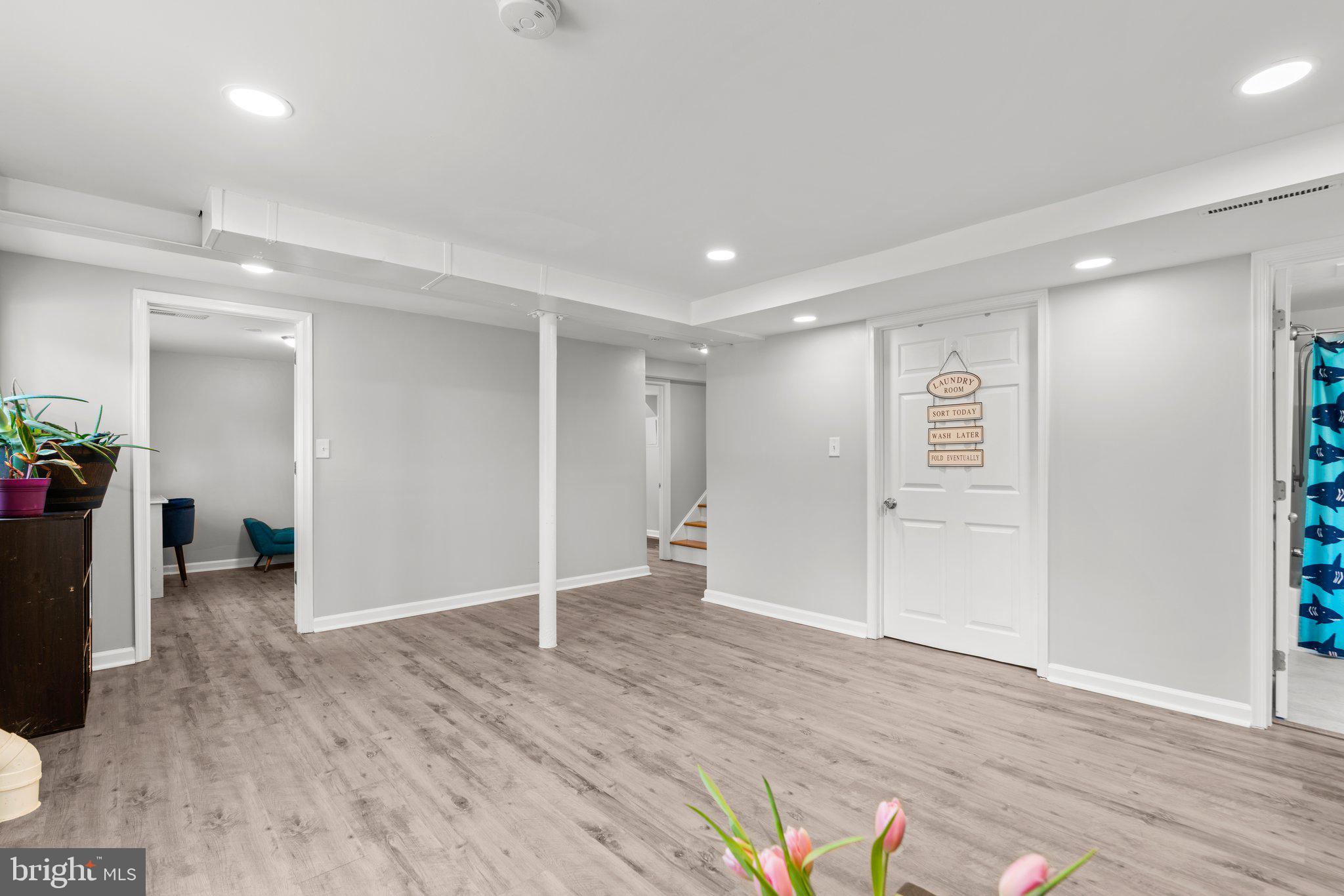 609 Perth Place Silver Spring, MD 20901 - Photo 35 of 46 a view of an empty room with wooden floor