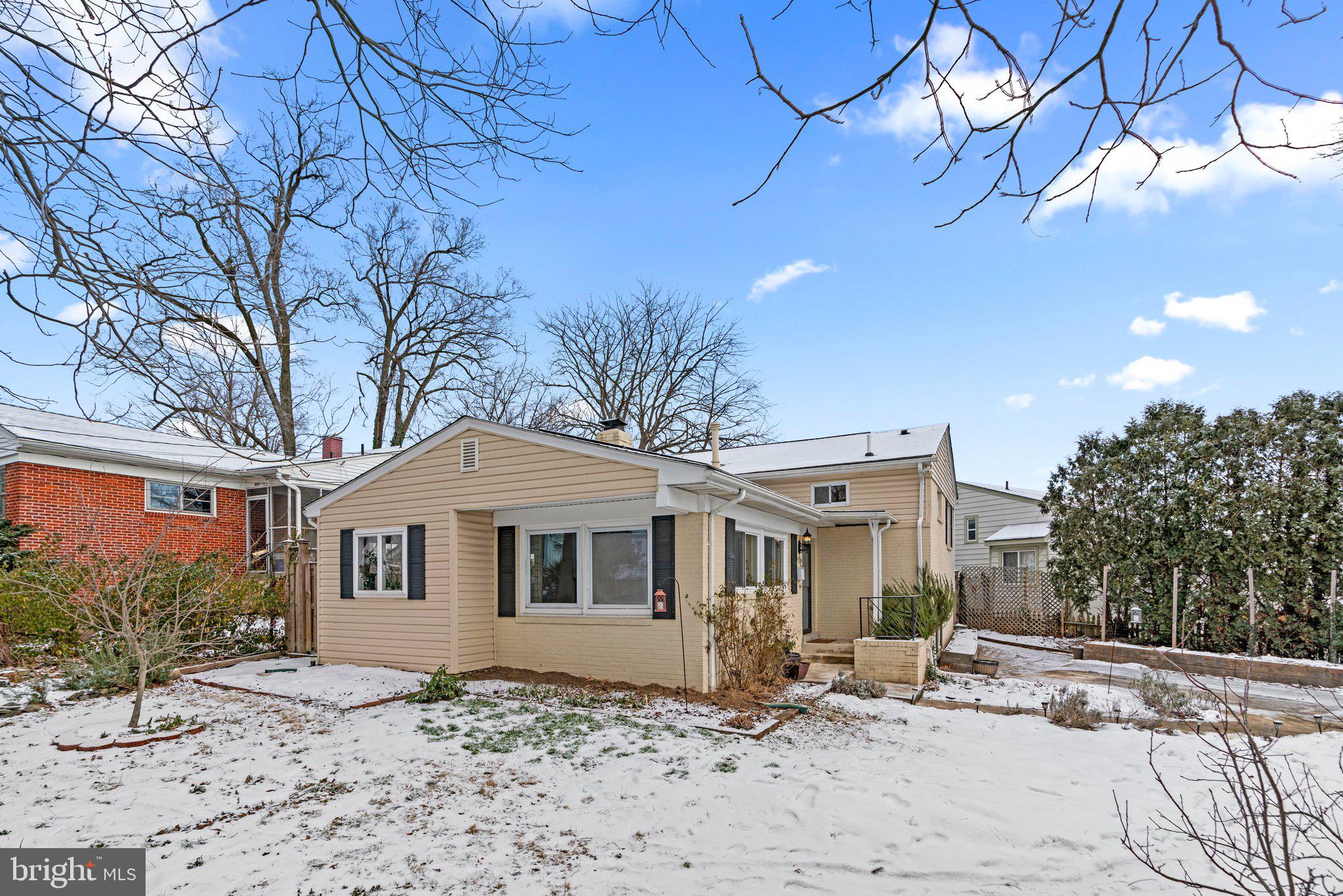 609 Perth Place Silver Spring, MD 20901 - Photo 4 of 46 a front view of a house with a yard
