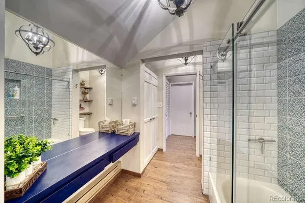a view of a livingroom with furniture and a window