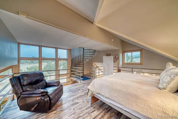 a bedroom with a bed and furniture