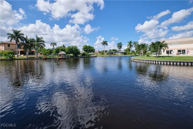 a view of a lake with a house in the background