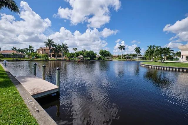 a view of a lake with a house in the background