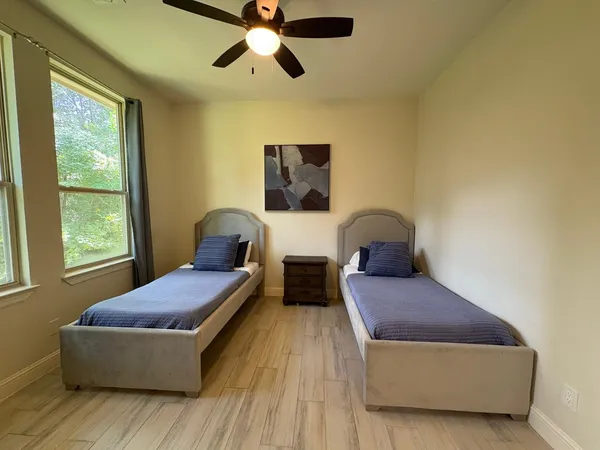 a bedroom with a bed and window