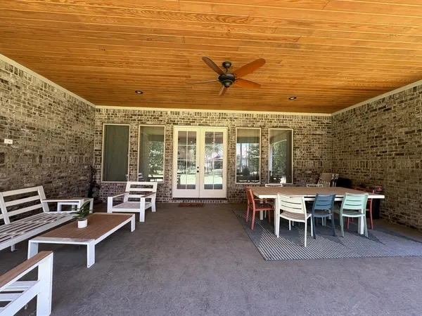 a outdoor space with lots of furniture and shower
