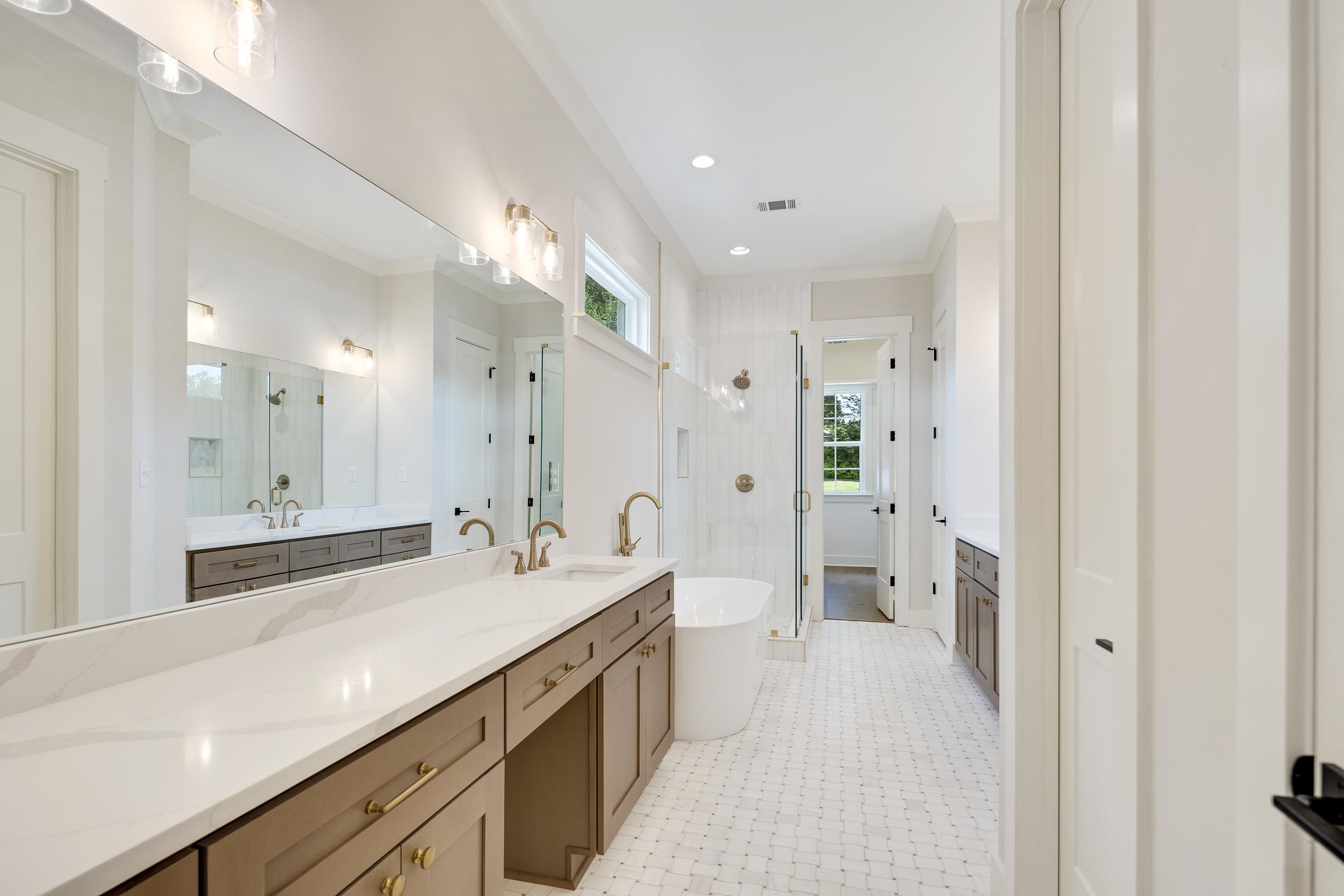 352 Avon Road Memphis, TN 38117 - Photo 13 of 26 Bathroom with a stall shower, vanity, a freestanding tub, recessed lighting, and crown molding