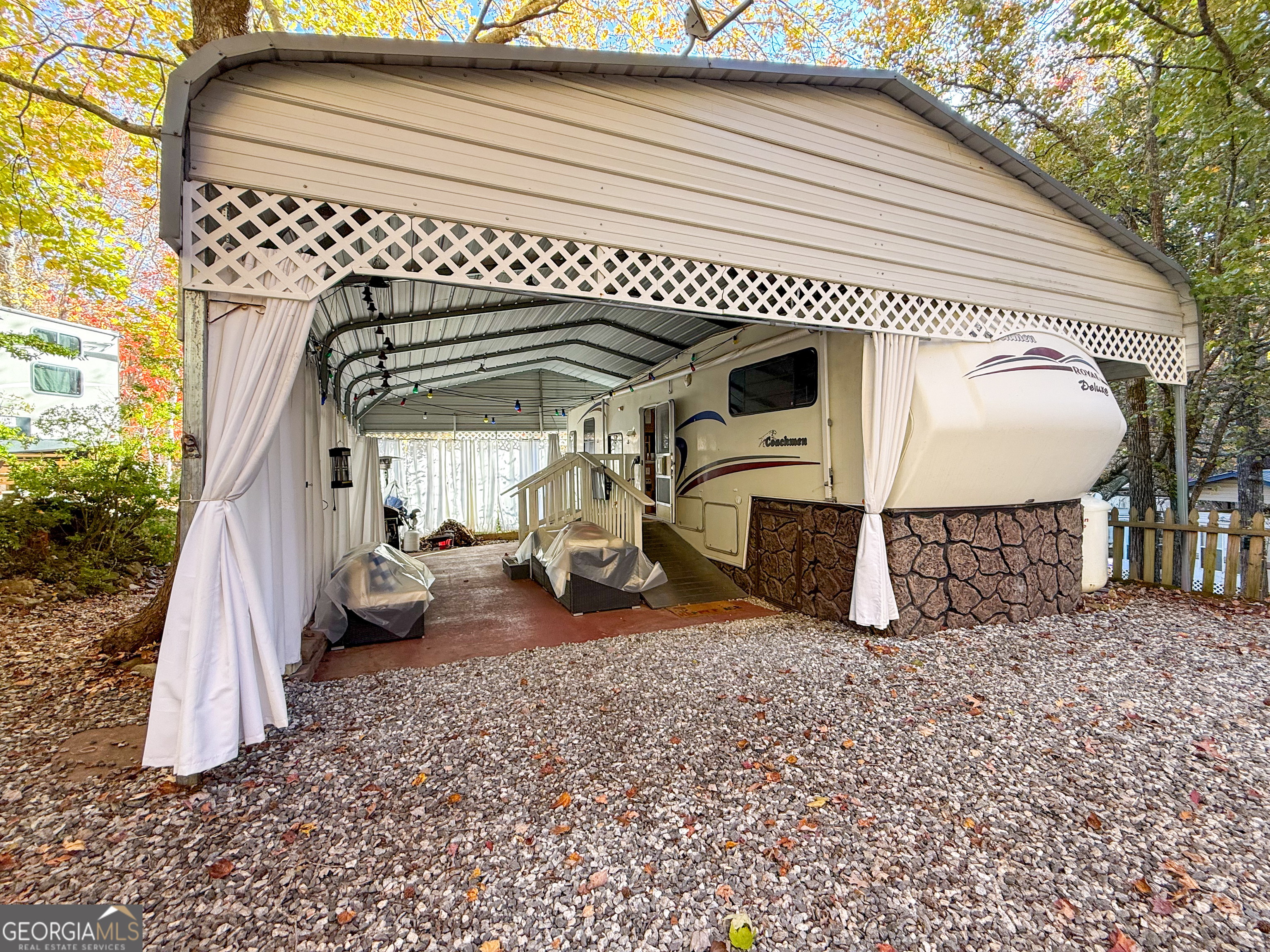 159 Canyon Pass Cleveland, GA 30528 - Photo 1 of 19 a view of front door and porch with furniture