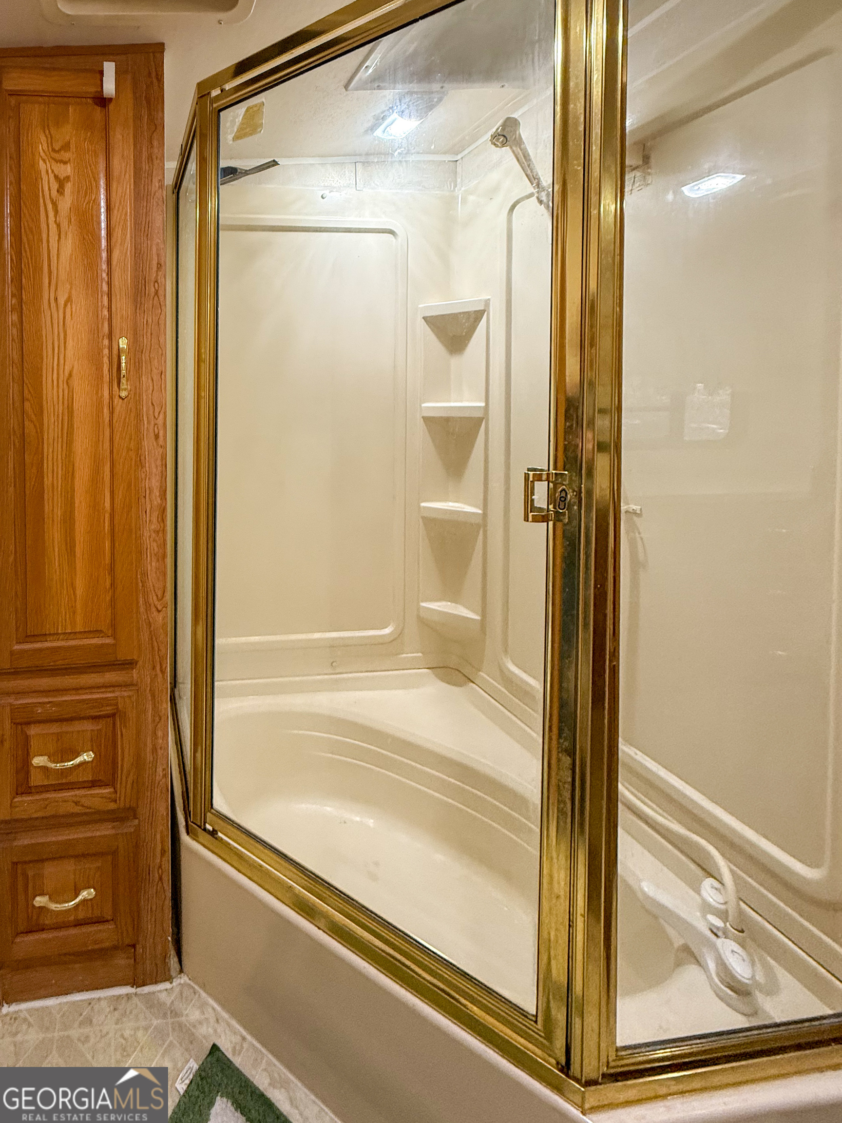 159 Canyon Pass Cleveland, GA 30528 - Photo 11 of 19 a bathroom with a glass shower door