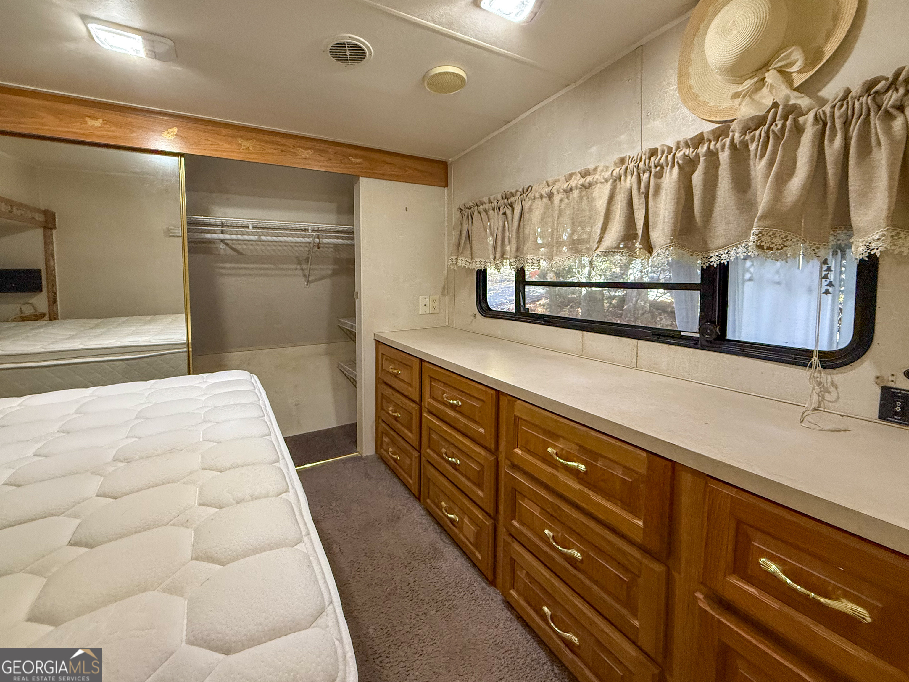 159 Canyon Pass Cleveland, GA 30528 - Photo 13 of 19 a spacious bathroom with a double vanity sink and a mirror