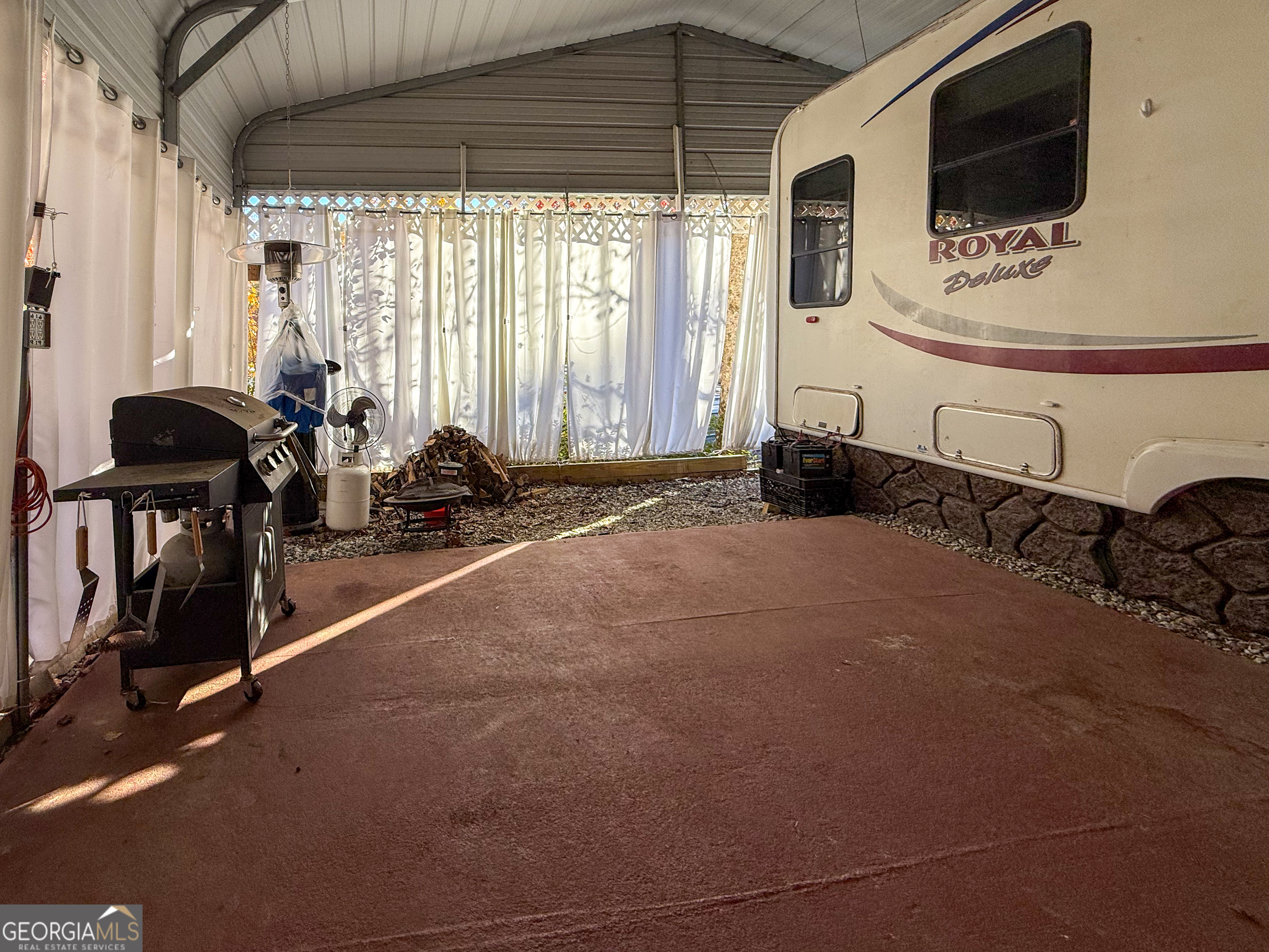 159 Canyon Pass Cleveland, GA 30528 - Photo 16 of 19 a room with gym equipment and flat screen tv