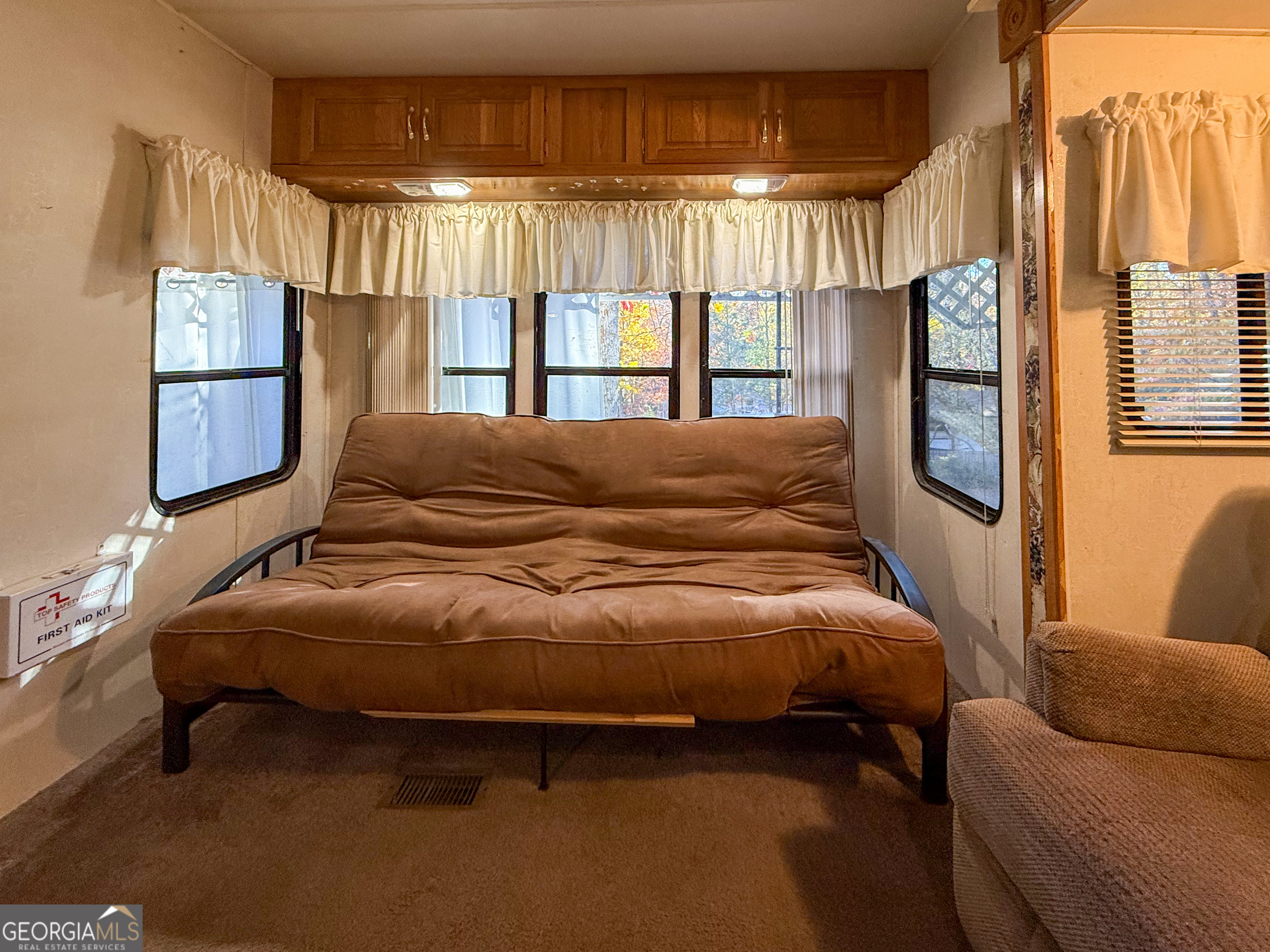 159 Canyon Pass Cleveland, GA 30528 - Photo 9 of 19 a bed sitting in a bedroom next to a window