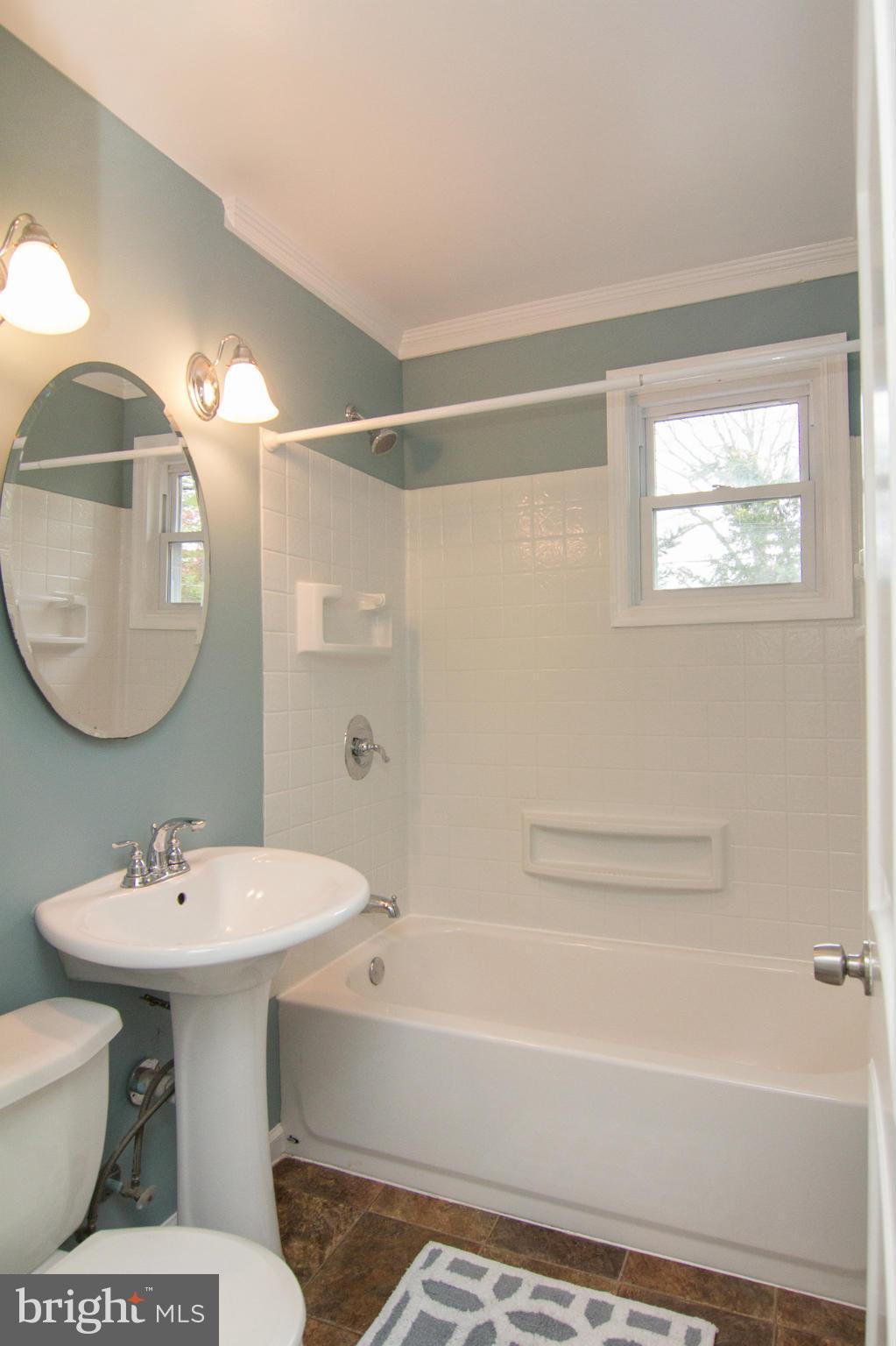 713 Overbrook Road Baltimore, MD 21212 - Photo 14 of 30 a bathroom with a sink toilet and shower