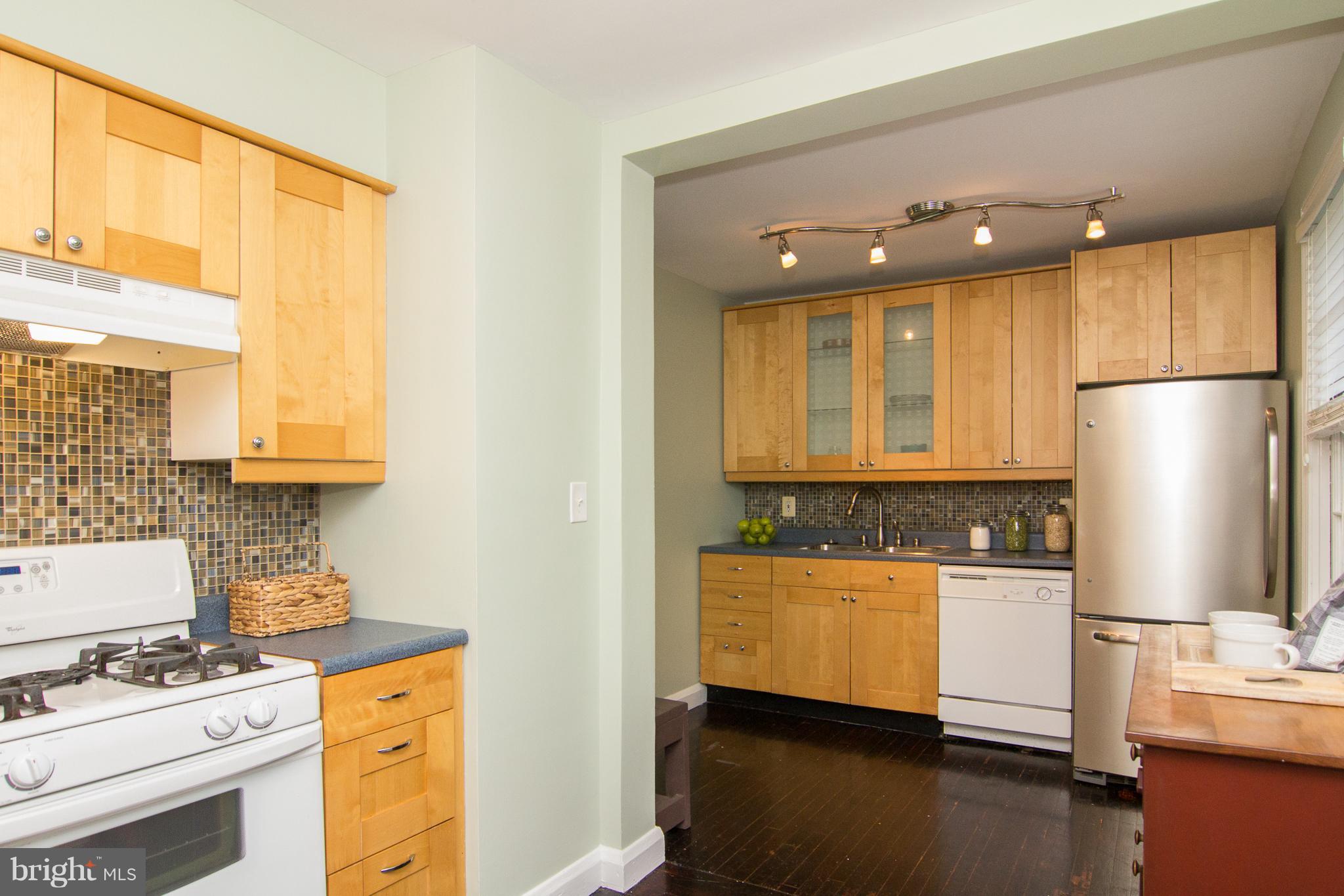 713 Overbrook Road Baltimore, MD 21212 - Photo 3 of 30 a kitchen with stainless steel appliances granite countertop a sink a stove and a refrigerator