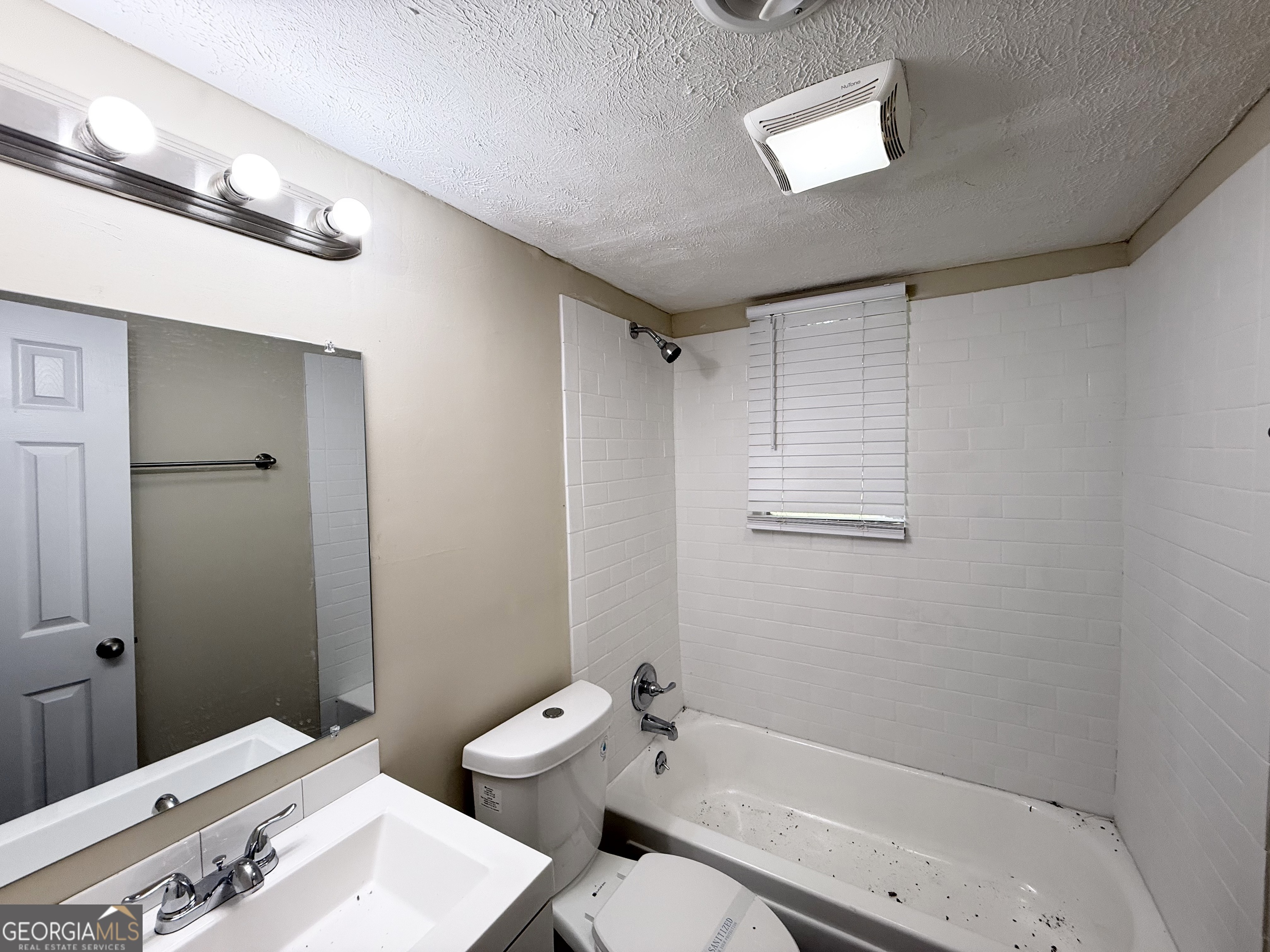 2782 Ocean Valley Road Atlanta, GA 30349 - Photo 24 of 27 a bathroom with a sink and toilet