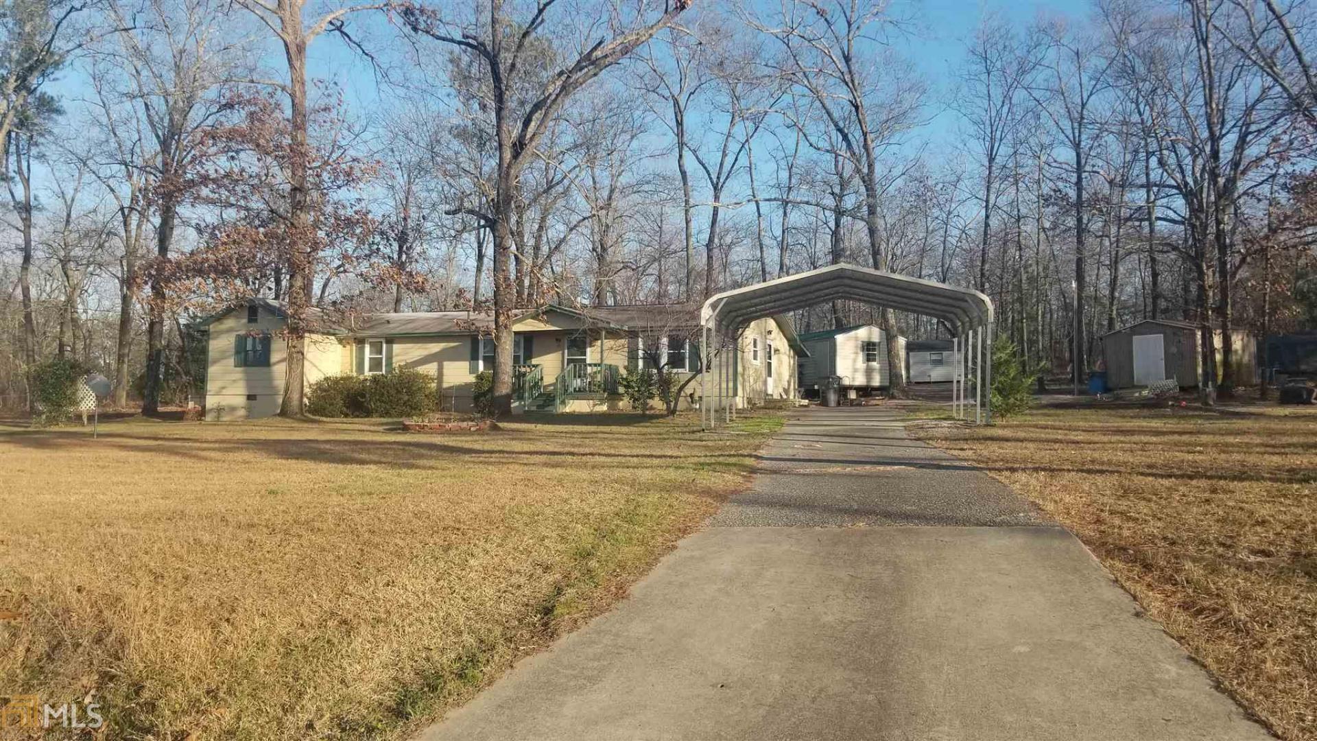 110 Union Hill Church Road Gordon, GA 31031 - Photo 1 of 1 a front view of a house with a yard