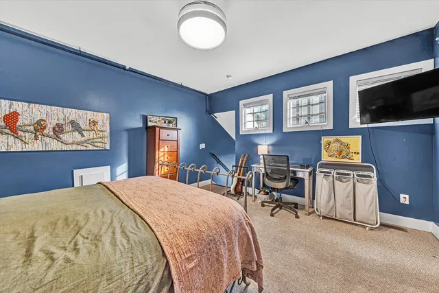 a bathroom with a sink toilet vanity and shower