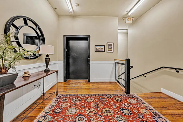 a view of a room with rack and bicycle