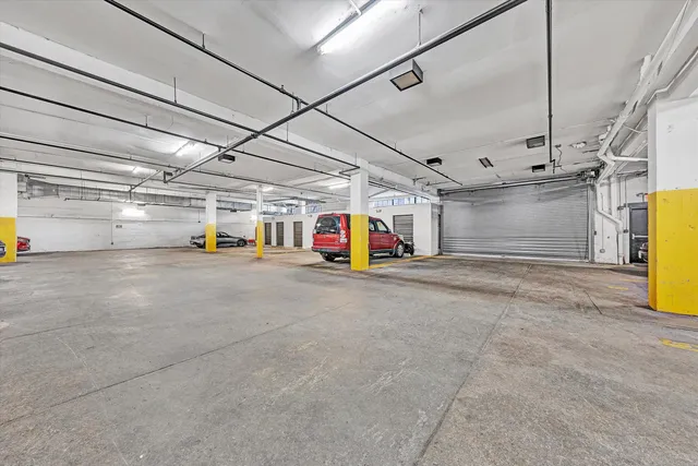 a utility room with stainless steel appliances and living room