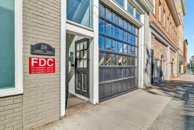 a view of a street with car parked on road